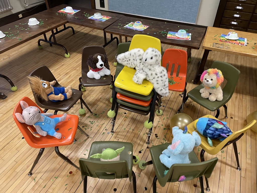 The leprechaun left chairs in a circle with stuffed animals sitting on them